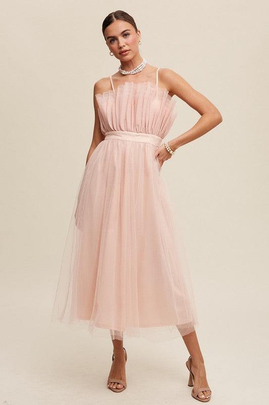 Paper Bag Frill Tulle Maxi DressThe Paper Bag Frill Tulle Maxi Dress exudes elegance and charm with its thoughtful design details. Featuring a removable and adjustable shoulder strap, it offers ver