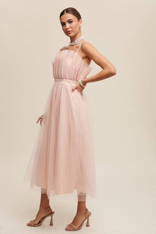 Paper Bag Frill Tulle Maxi DressThe Paper Bag Frill Tulle Maxi Dress exudes elegance and charm with its thoughtful design details. Featuring a removable and adjustable shoulder strap, it offers ver