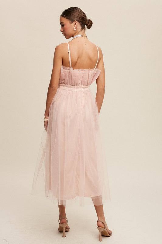 Paper Bag Frill Tulle Maxi DressThe Paper Bag Frill Tulle Maxi Dress exudes elegance and charm with its thoughtful design details. Featuring a removable and adjustable shoulder strap, it offers ver