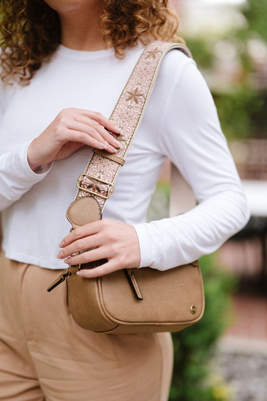 Gentry Crossbody Boho Shoulder Purse BagIntroducing the Gentry Crossbody, a must-have boho bag for the fashion-forward and free-spirited. This medium-sized crossbody is crafted from premium vegan leather t