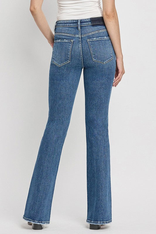 High Rise Slant Hem Flare JeansElevate your denim game with our High Rise Slant Hem Flare Jeans. Featuring a comfortable high rise waist and a unique slant hem design, these jeans offer a modern t