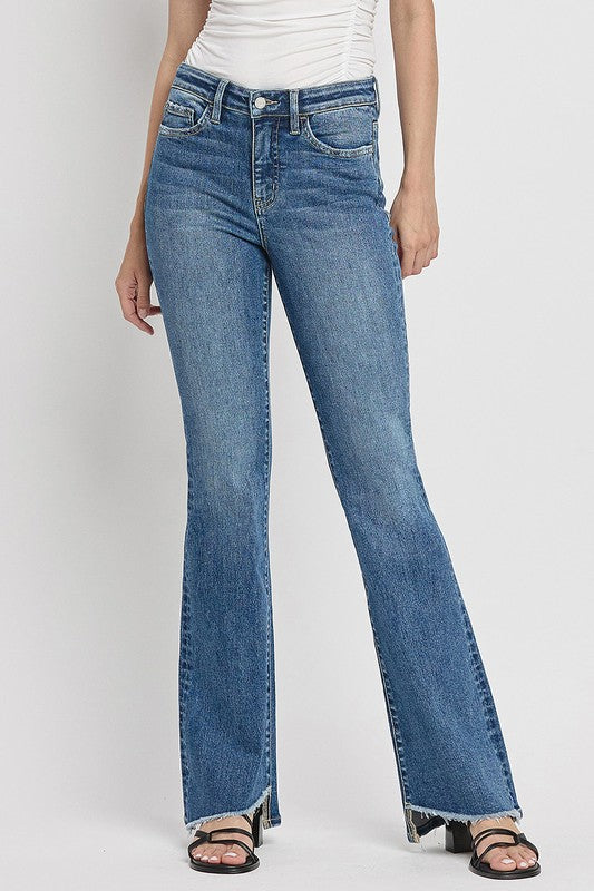 High Rise Slant Hem Flare JeansElevate your denim game with our High Rise Slant Hem Flare Jeans. Featuring a comfortable high rise waist and a unique slant hem design, these jeans offer a modern t