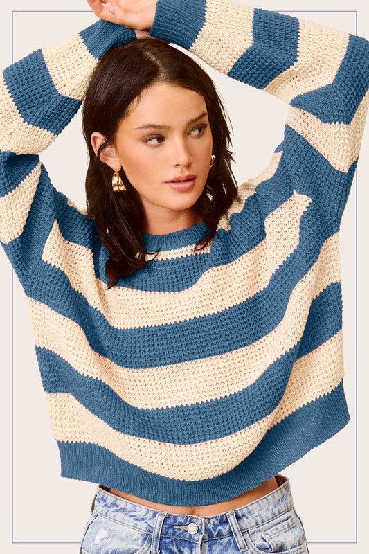 Striped Round Neck Loose Fit SweaterStylish pullover you would love to be in all day. Featured in a striped knit fabrication with long sleeve, round neckline and a loose fit. Match with any bottoms suc