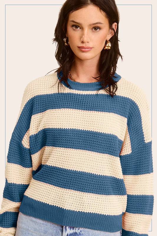 Striped Round Neck Loose Fit SweaterStylish pullover you would love to be in all day. Featured in a striped knit fabrication with long sleeve, round neckline and a loose fit. Match with any bottoms suc