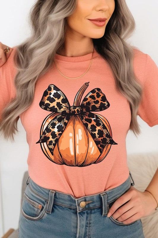 Coquette Bow Pumpkin Graphic T ShirtsCoquette Bow Pumpkin Graphic T Shirts.Unisex Crew Neck Short Sleeve Tees.Crafted from premium materials, tailored to your lifestyle, ensuring a comfortable fit for a