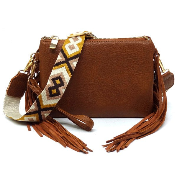 Aztec Guitar Strap Fringe Clutch Crossbody BagAztec Guitar Strap Fringe Clutch Crossbody Bag Faux vegan leather Zip top closure Gold-tone hardware Detachable shoulder strap L 8.5 * H 6 * W 3