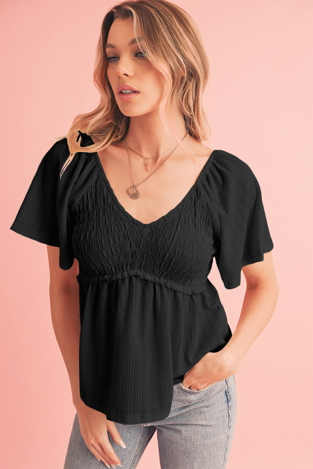 Tomato Red Shirred V Neck Short Flutter Sleeve Textured BlouseMaterial:95%POLYESTER+5%ELASTANE



		The blouse is a charming and feminine top featuring a shirred V-neckline and delicate flutter sleeves, adding a touch of eleg