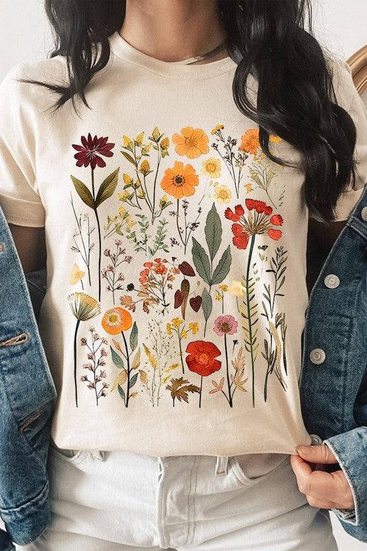 Botanical Wildflowers Graphic TeeBotanical Wildflowers Graphic Tee.Unisex Crew Neck Short Sleeve Tees.Crafted from premium materials, tailored to your lifestyle, ensuring a comfortable fit for any o