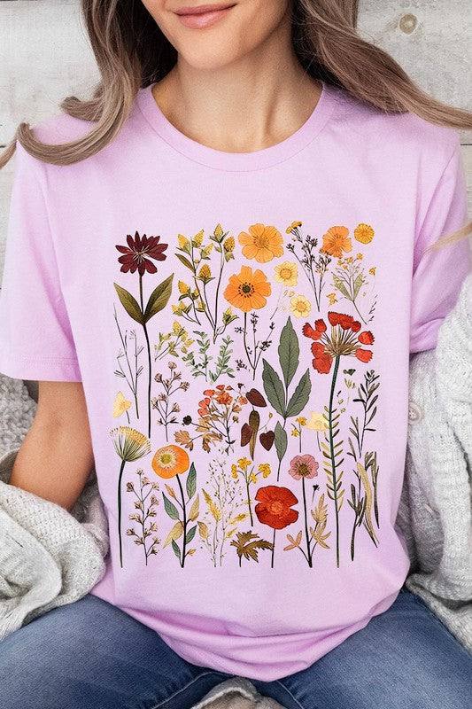 Botanical Wildflowers Graphic TeeBotanical Wildflowers Graphic Tee.Unisex Crew Neck Short Sleeve Tees.Crafted from premium materials, tailored to your lifestyle, ensuring a comfortable fit for any o