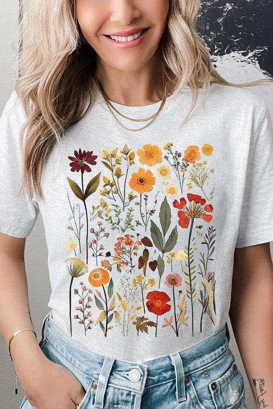 Botanical Wildflowers Graphic TeeBotanical Wildflowers Graphic Tee.Unisex Crew Neck Short Sleeve Tees.Crafted from premium materials, tailored to your lifestyle, ensuring a comfortable fit for any o