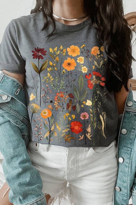 Botanical Wildflowers Graphic TeeBotanical Wildflowers Graphic Tee.Unisex Crew Neck Short Sleeve Tees.Crafted from premium materials, tailored to your lifestyle, ensuring a comfortable fit for any o