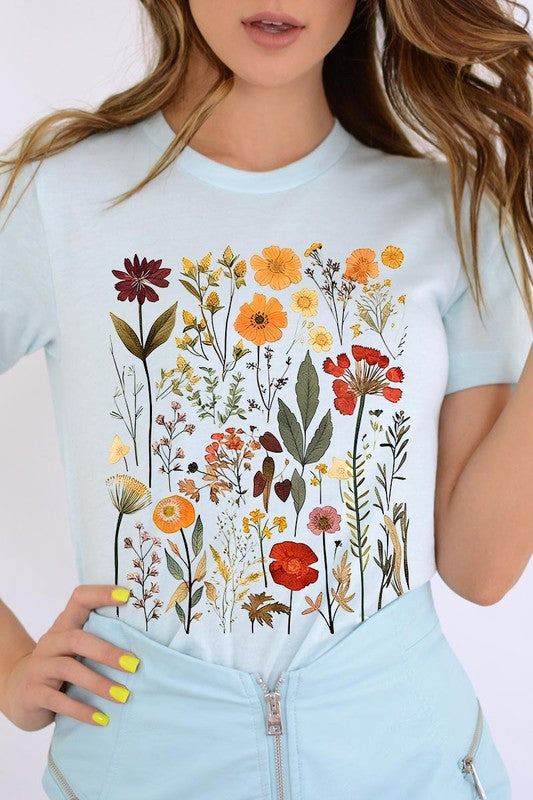 Botanical Wildflowers Graphic TeeBotanical Wildflowers Graphic Tee.Unisex Crew Neck Short Sleeve Tees.Crafted from premium materials, tailored to your lifestyle, ensuring a comfortable fit for any o