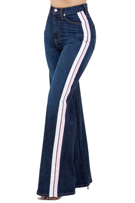 Striped Wide Leg Pant in Dark DenimAdd a playful touch to your wardrobe with our Striped Wide Leg Pants! Made in the USA, these high rise jeans feature a wide leg fit, front button and zipper closure,