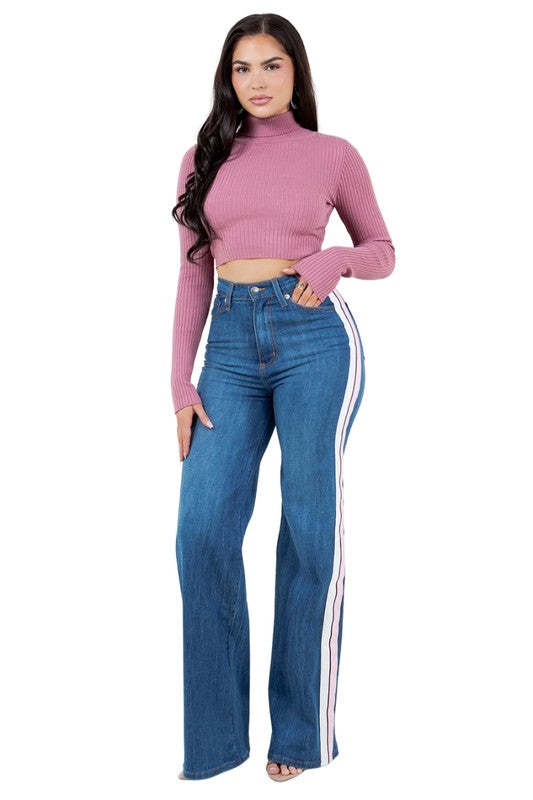 Striped Wide Leg JeanAdd a playful touch to your wardrobe with our Striped Wide Leg Pants! Made in the USA, these high rise jeans feature a wide leg fit, front button and zipper closure,