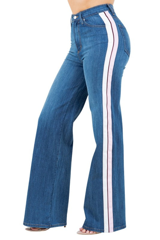 Striped Wide Leg JeanAdd a playful touch to your wardrobe with our Striped Wide Leg Pants! Made in the USA, these high rise jeans feature a wide leg fit, front button and zipper closure,