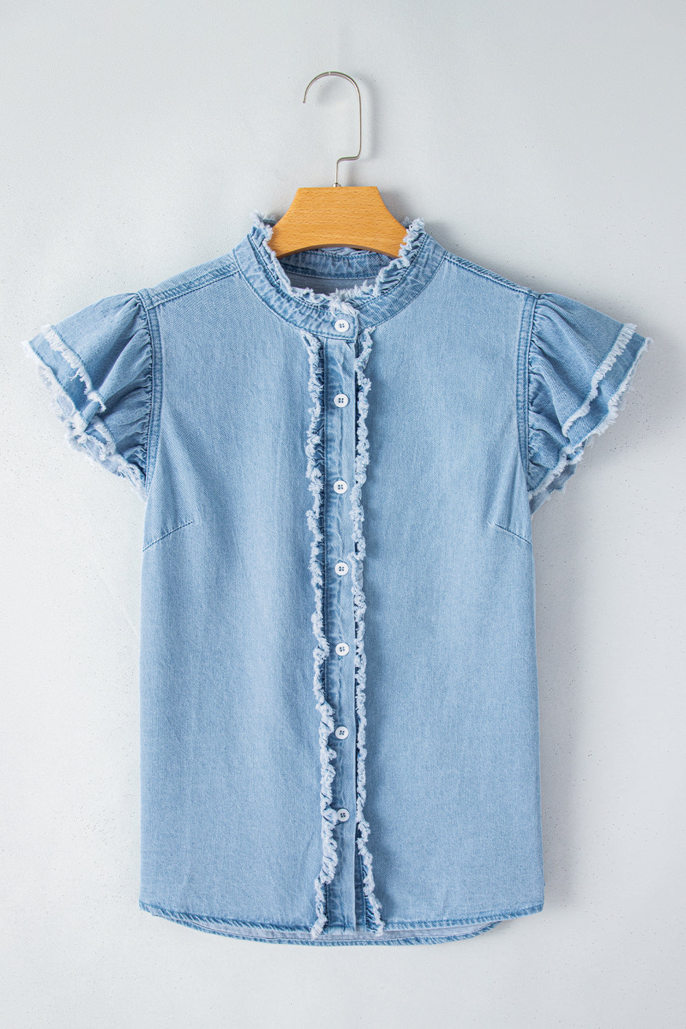 Beau Blue Button Front Ruffled Flutter Frayed Denim TopMaterial:100%Cotton



		The ruffled flutter sleeves create a playful and flirty look, adding movement and charm to the overall design.
	
	
		The frayed detaili