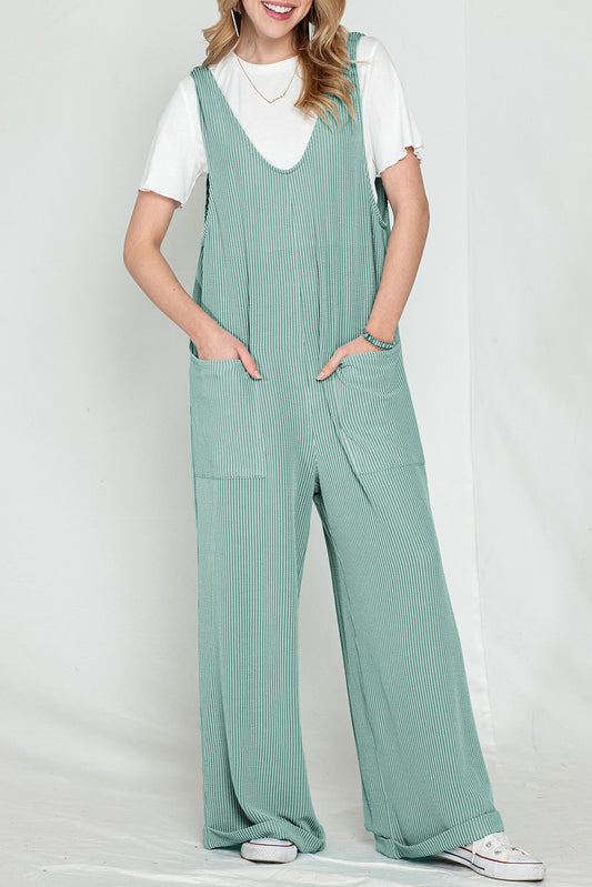 Parchment Pockets Oversized Ribbed Wide Leg JumpsuitMaterial:75％Polyester+20％Viscose+5％Elastane



		The jumpsuit is colored in a vibrant shade, adding a pop of color to your outfit.
	
	
		It features an oversize