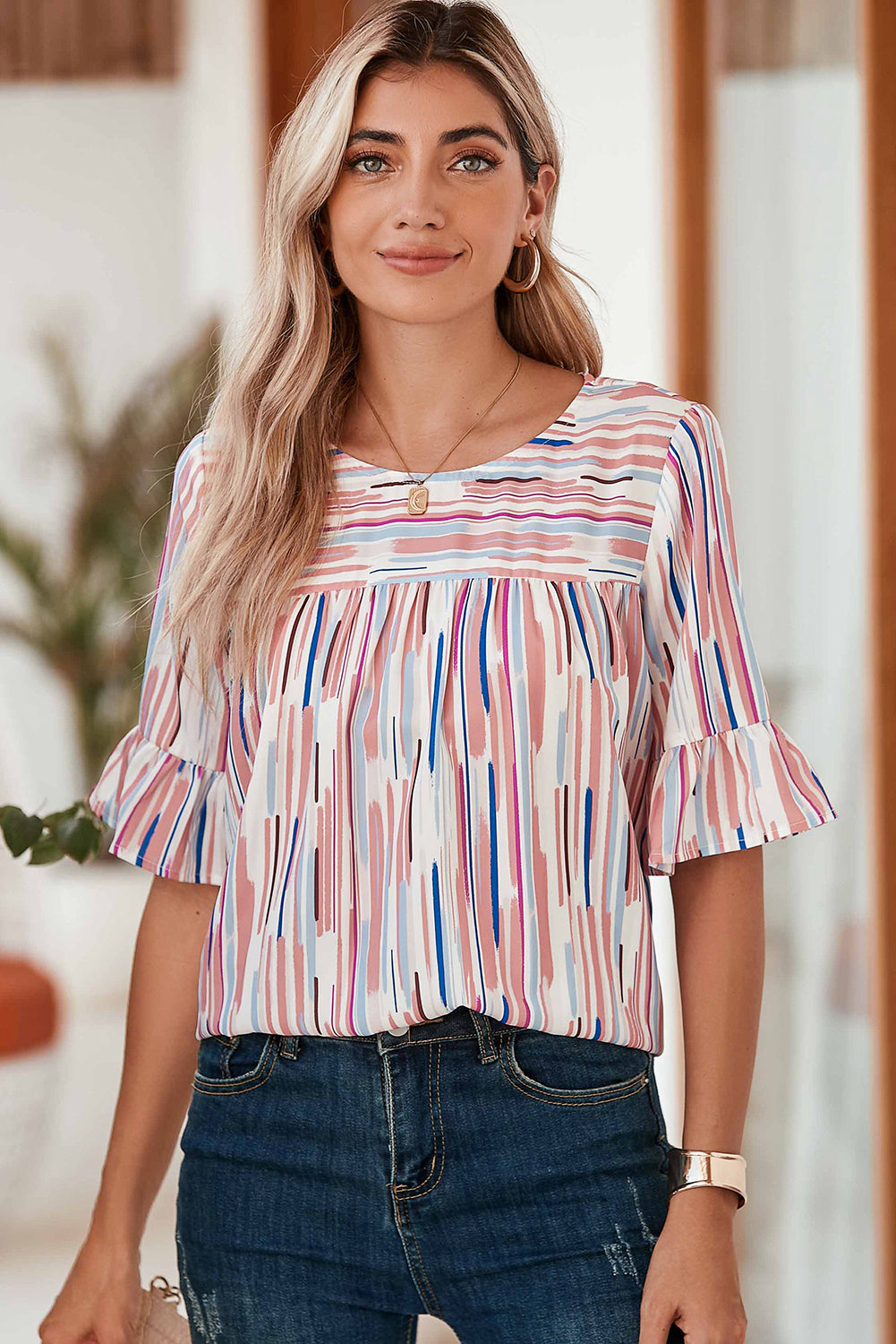 White Abstract Print Ruffle Half Sleeve BlouseMaterial:100%Polyester



		The blouse features a colorblock design, where different colors are strategically placed to create a visually striking contrast. 
	
	