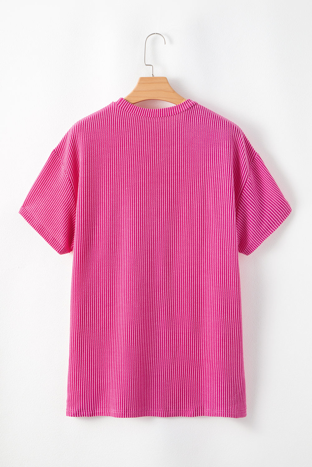 Pink Crinkle Rib Knit Pocketed Loose Fit Crew Neck T ShirtMaterial:75%Polyester+20%Viscose+5%Elastane

• Pink T Shirt offers a charming, feminine touch with its soft pink color and crinkle rib texture, perfect for a casual