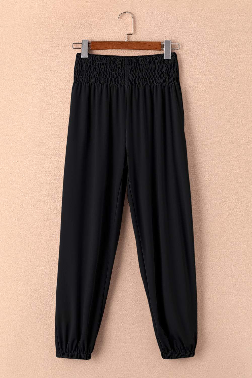 Black Pocketed Smocked High Waist JoggersMaterial:95%Polyester+5%Elastane



		These jogger pants are very cozy to wear with 95%Polyester+5%Elastane made
	
	
		The smocked design adds a stylish touch a