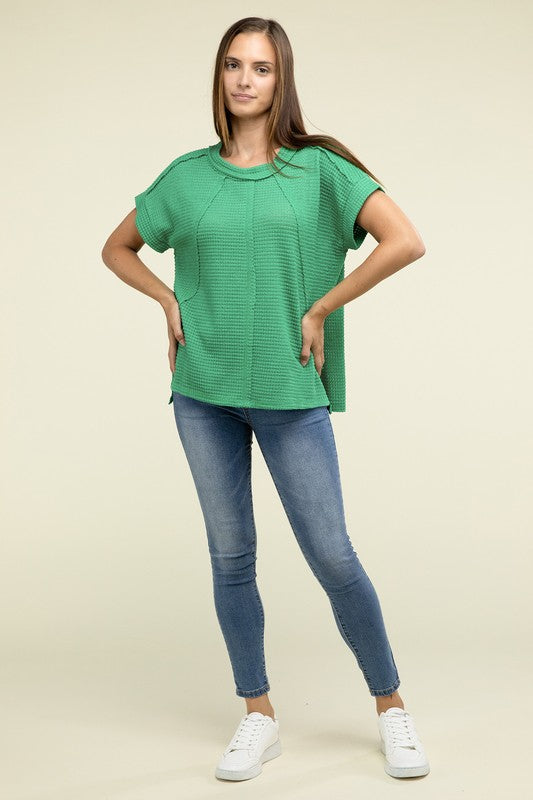 Brushed Waffle Exposed-Seam Short Sleeve TopElevate your casual wardrobe with this Brushed Waffle Top, featuring side slits, exposed seam details, and a stylish hi-low hem. Perfect for a relaxed yet trendy loo