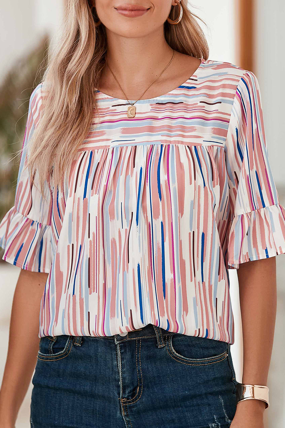 White Abstract Print Ruffle Half Sleeve BlouseMaterial:100%Polyester



		The blouse features a colorblock design, where different colors are strategically placed to create a visually striking contrast. 
	
	