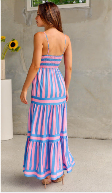 Pink Stripe Print Shirred Backless Pocket Maxi DressMaterial:95%Polyester+5%Elastane

• The dress features a trendy striped design that exudes casual charm, perfect for everyday wear.
• The shirred detailing on the 