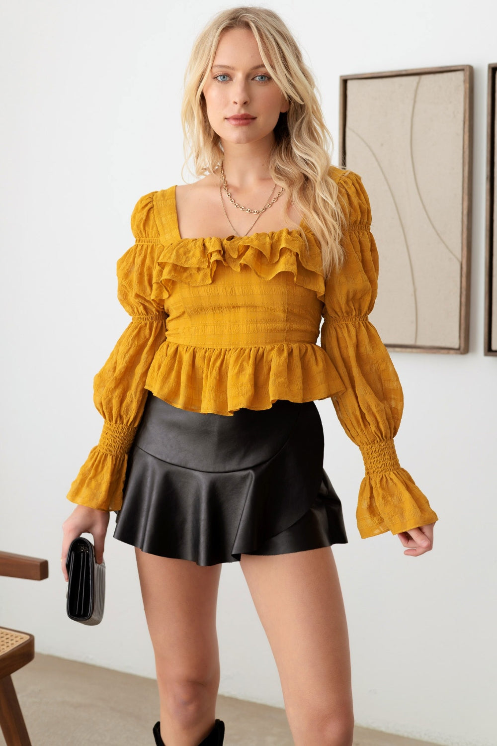 Mustard Seed Boho Shirred Smocked Peplum Long Sleeve TopThis boho shirred smocked peplum long sleeve top is a perfect blend of bohemian and chic style. The shirred detailing adds texture and dimension to the top. The smoc