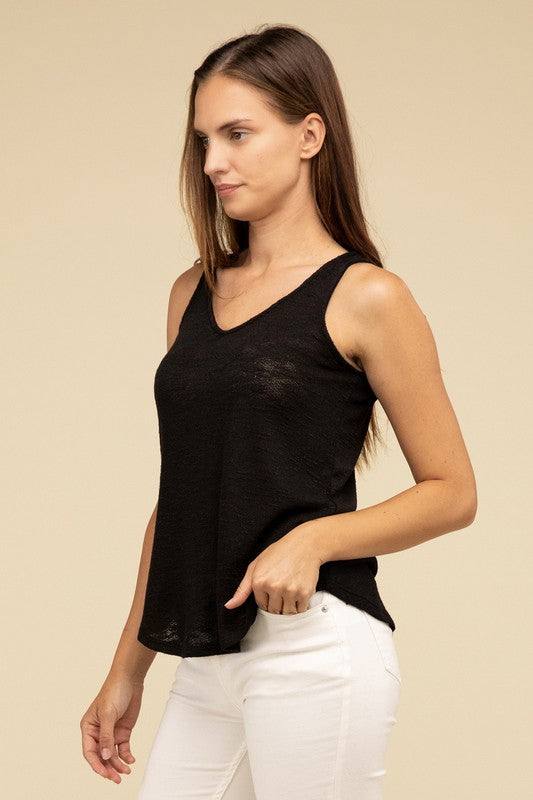 V Neck Sleeveless Cami TopThe V Neck Sleeveless Cami Top is a chic and versatile addition to any wardrobe. Featuring a flattering V neckline and a sleeveless design, this cami top is perfect 