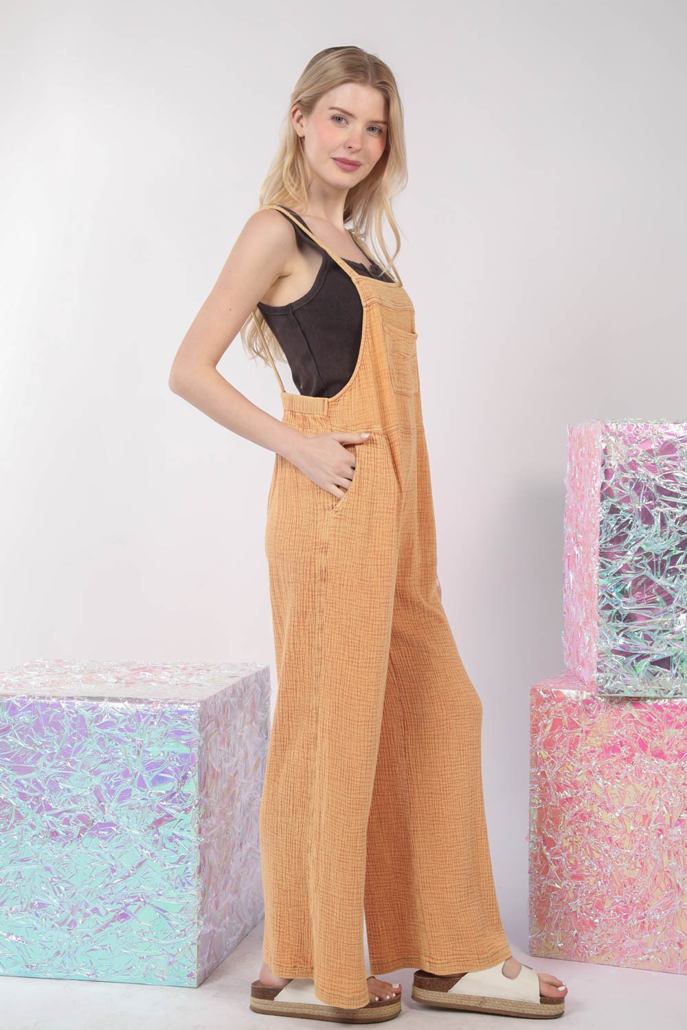 VERY J Texture Washed Wide Leg OverallsThe texture washed wide leg overalls offer a stylish and relaxed look with a touch of vintage charm. Made from textured fabric, these overalls have a unique appearan