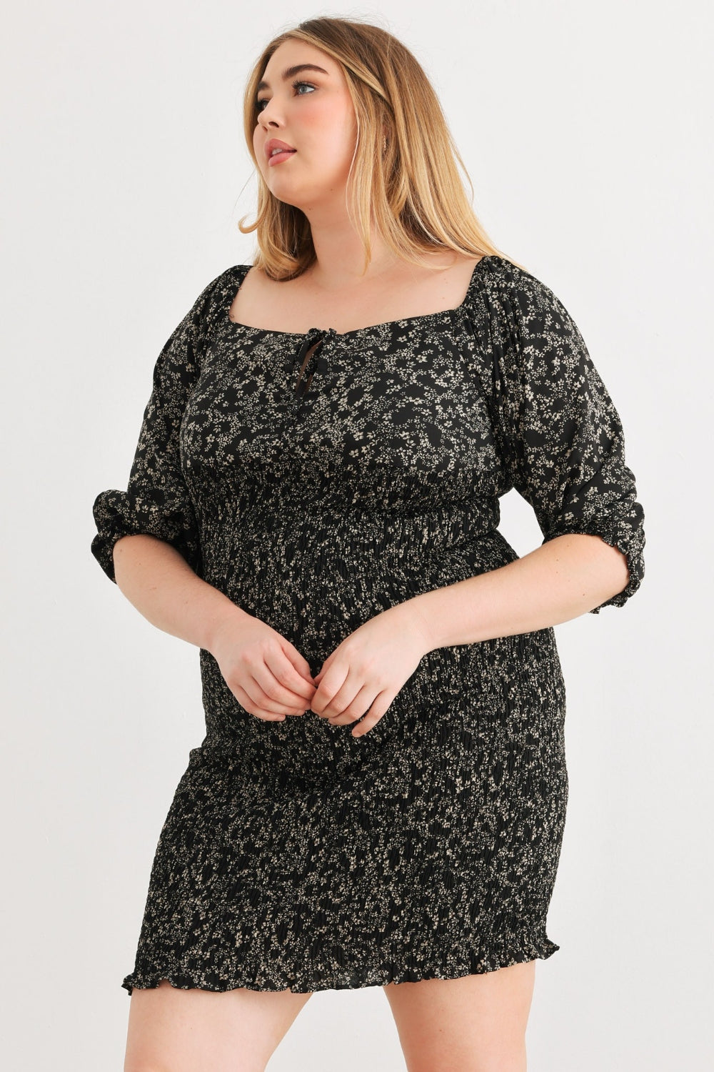 Zenobia Plus Size Smocked Printed Square Neck Mini DressSmocked Printed Square Neck Mini Dress is a trendy and feminine choice for any occasion. The square neckline adds a touch of elegance, while the smocked detailing en