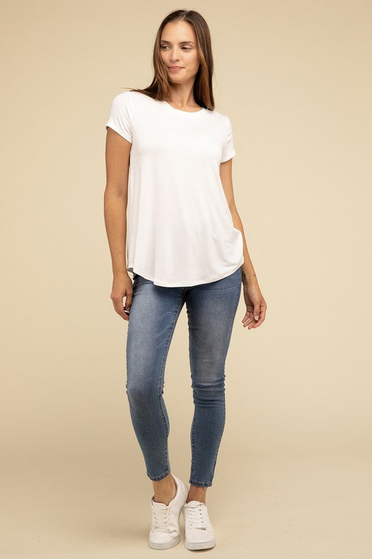 Flowy Round Hem Rayon Short Sleeve TopThe Flowy Round Hem Rayon Short Sleeve Top is the perfect addition to your casual wardrobe. Crafted from soft, lightweight rayon, this top features a relaxed fit and