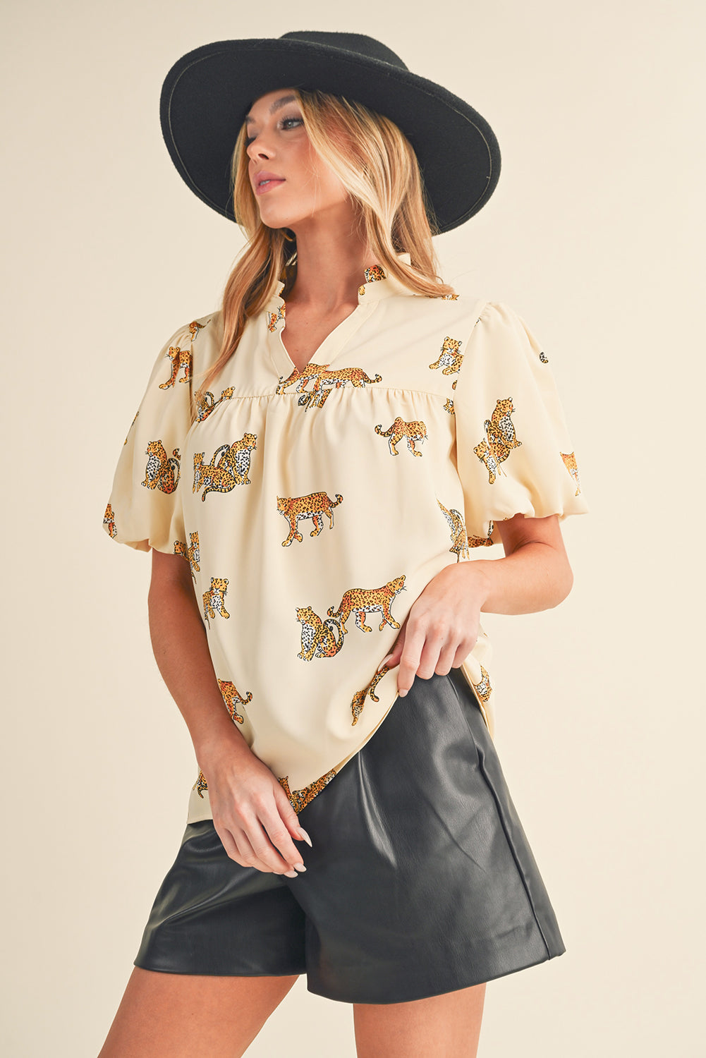 Apricot Animal Print V Neck Puff Sleeve BlouseMaterial:100%Polyester



		The blouse features an animal print pattern, which adds a bold and eye-catching element to the design. 
	
	
		Animal prints, such as