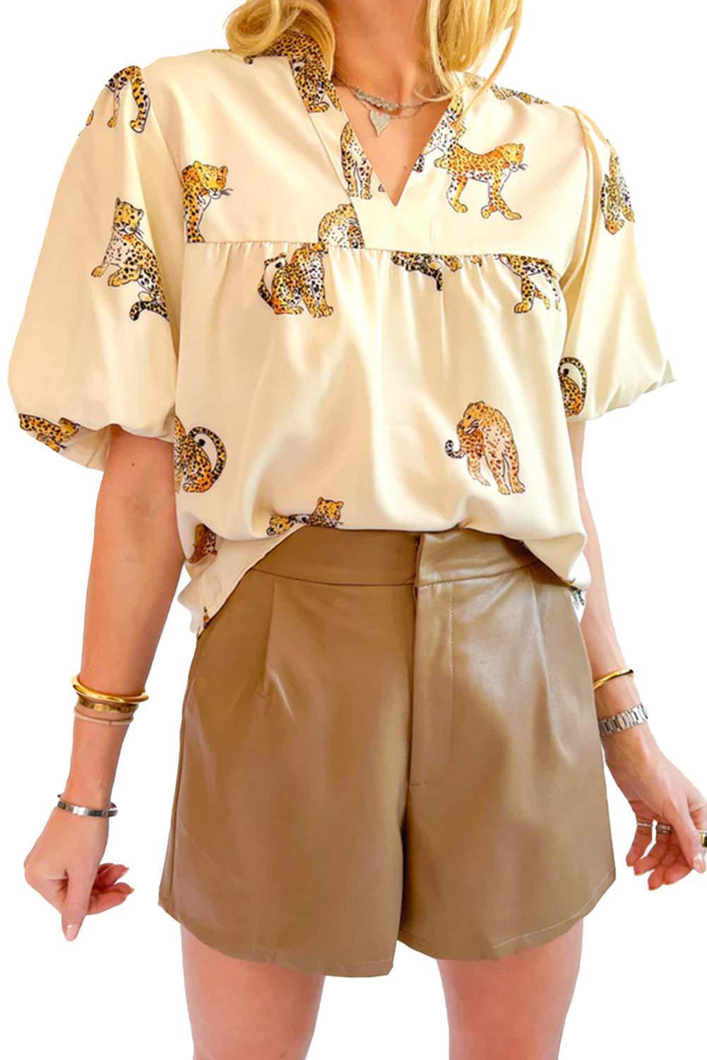 Apricot Animal Print V Neck Puff Sleeve BlouseMaterial:100%Polyester



		The blouse features an animal print pattern, which adds a bold and eye-catching element to the design. 
	
	
		Animal prints, such as