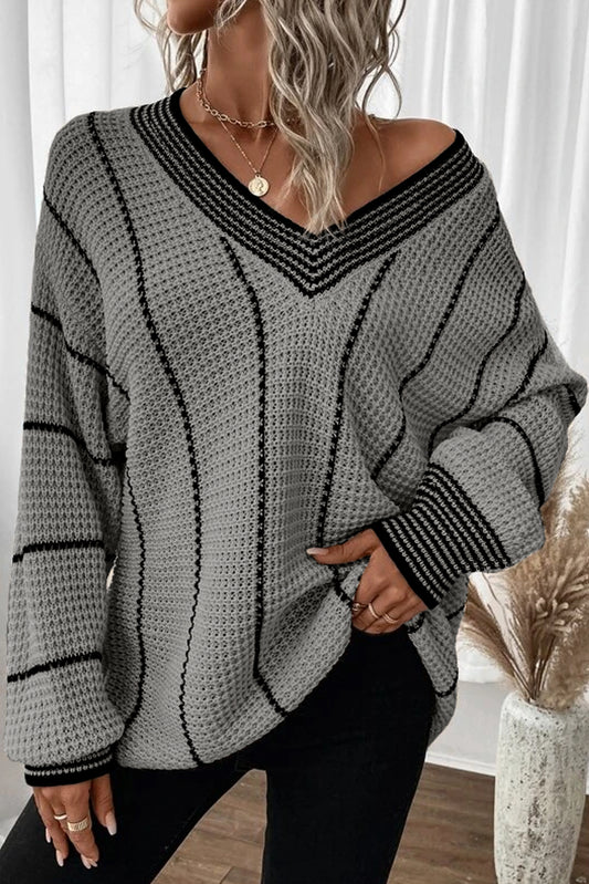 Gray Contrast V Neck Loose Tunic SweaterMaterial:100%Acrylic

• Embrace effortless style in this sweater, perfect for casual chic looks.
• The colorblock design adds a modern touch, while the V-neckline 