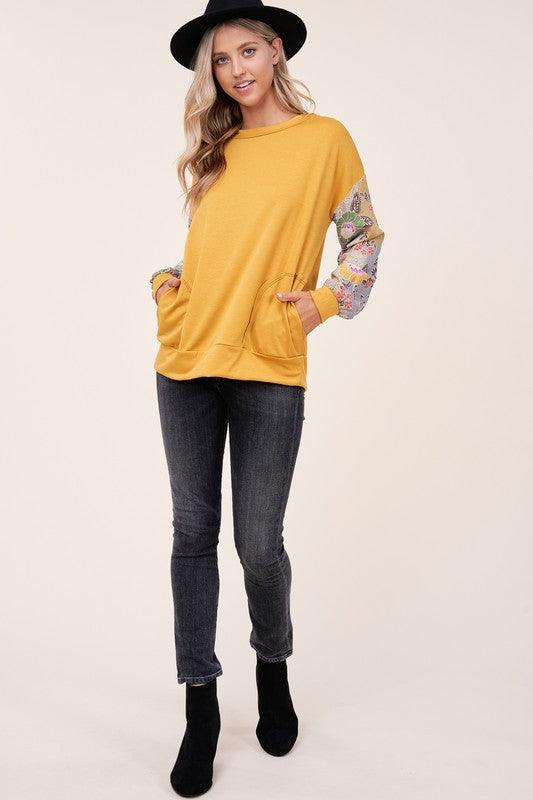 WOVEN FLORAL MIXED TOPFRENCH TERRY SOLID AND WOVEN FLORAL PRINT MIXED LONG SLEEVE SIDE POCKET RAW EDGE DETAIL TOP - MADE IN U.S.A.
Style: Casual
Print / Pattern: SOLID AND WOVEN FLORAL 
F