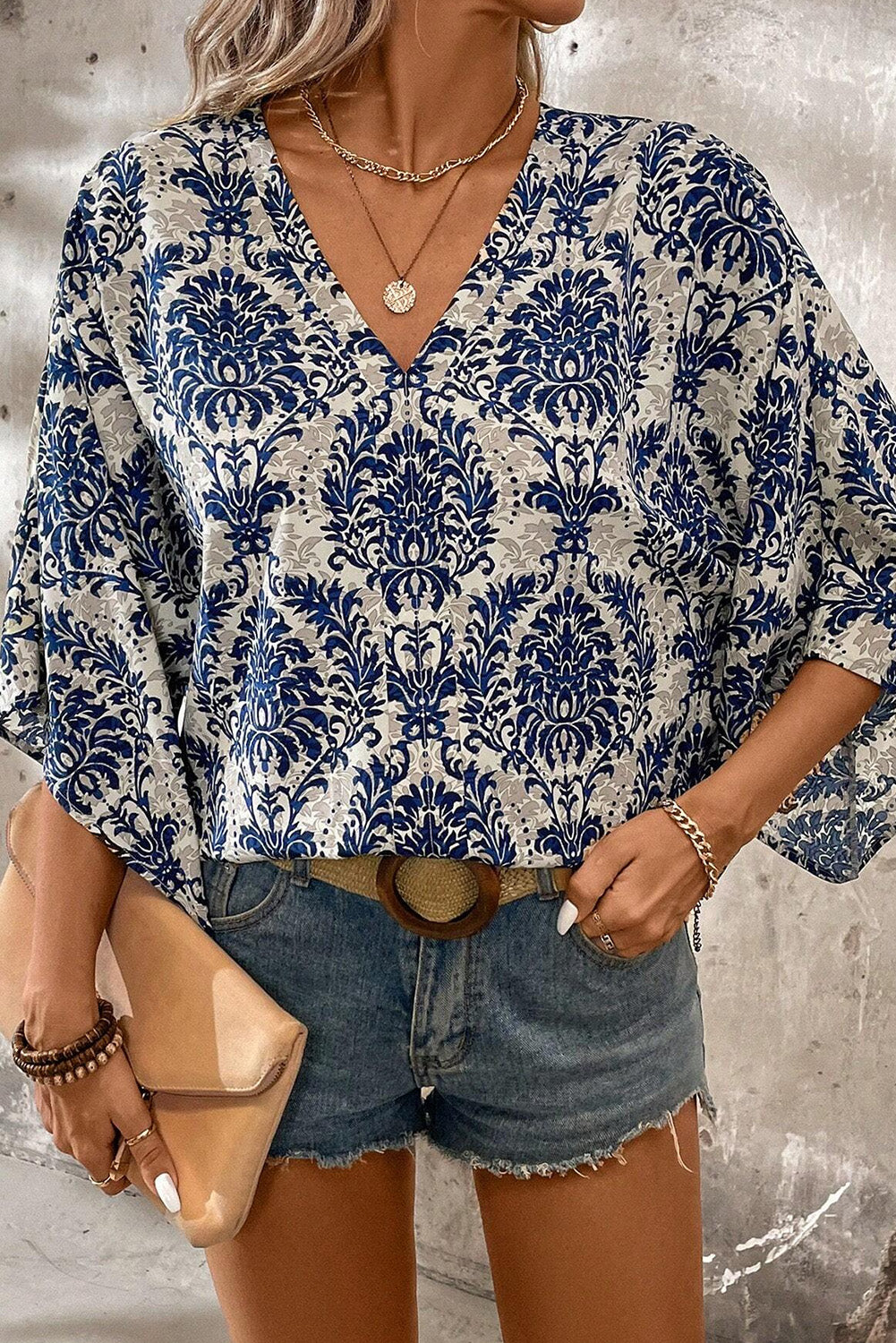 Blue Bohemian Print V Neck Flounce Sleeve BlouseMaterial:100%Polyester



		The three-quarter length sleeves offer a comfortable and stylish fit, perfect for both casual outings and special occasions.
	
	
		S