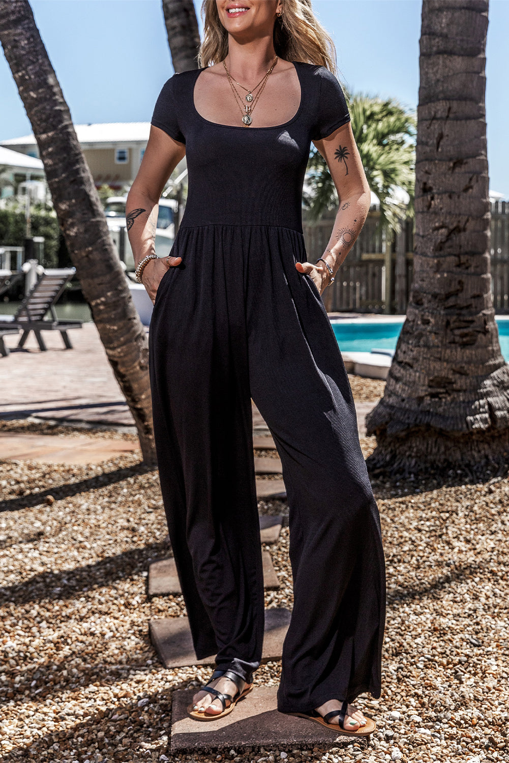 Black Pleated High Waist U Neck Short Sleeve JumpsuitMaterial:95%Polyester+5%Elastane

• Elevate your night club look with this chic black jumpsuit featuring a flattering high waist design and stylish pleats that effo