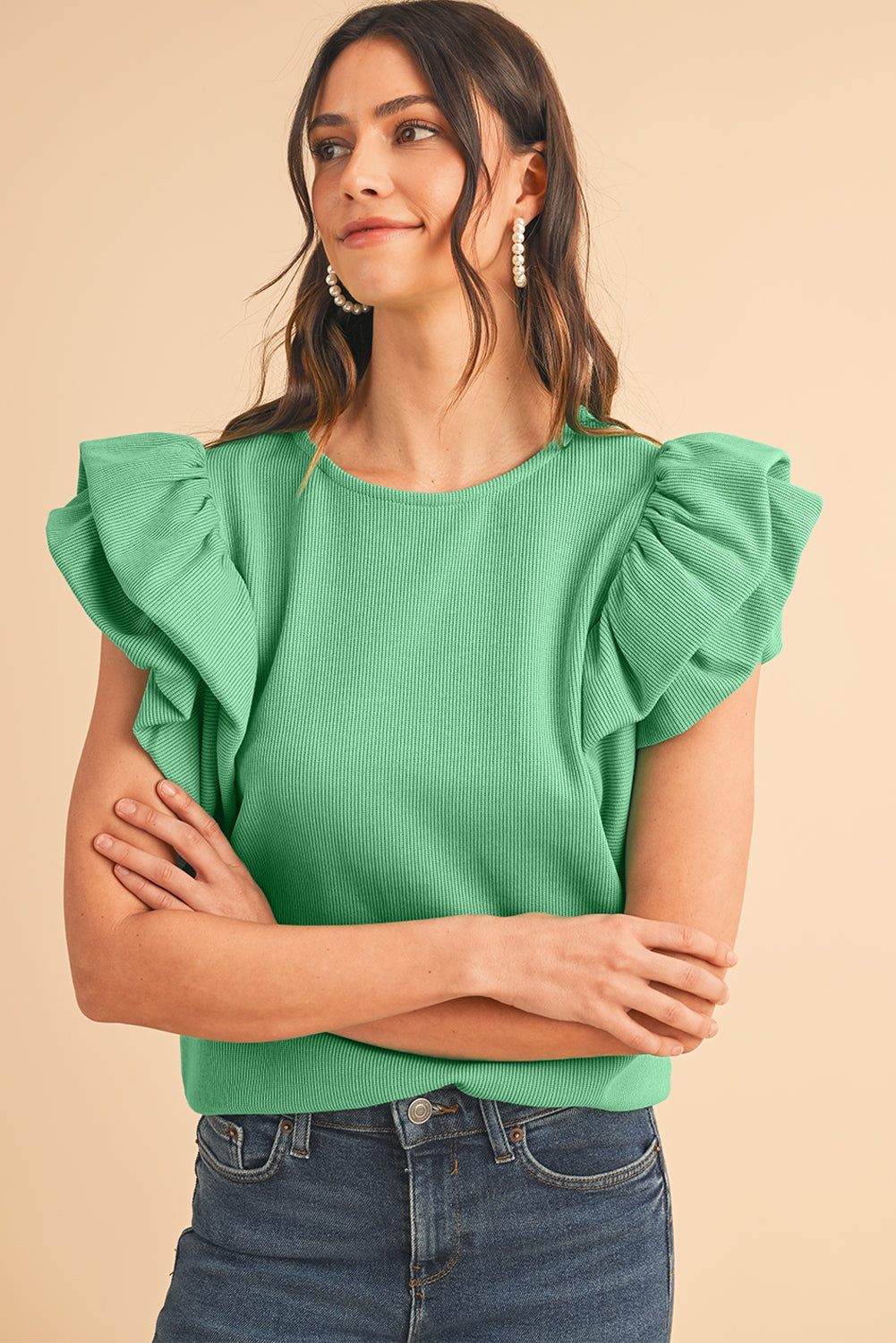 Green Solid Color Ruffle Sleeve Ribbed BlouseMaterial:65%cotton+33%polyester+2%Elastane



		The blouse features ruffle sleeves, which add a playful and romantic touch to the overall design. 
	
	
		The sol