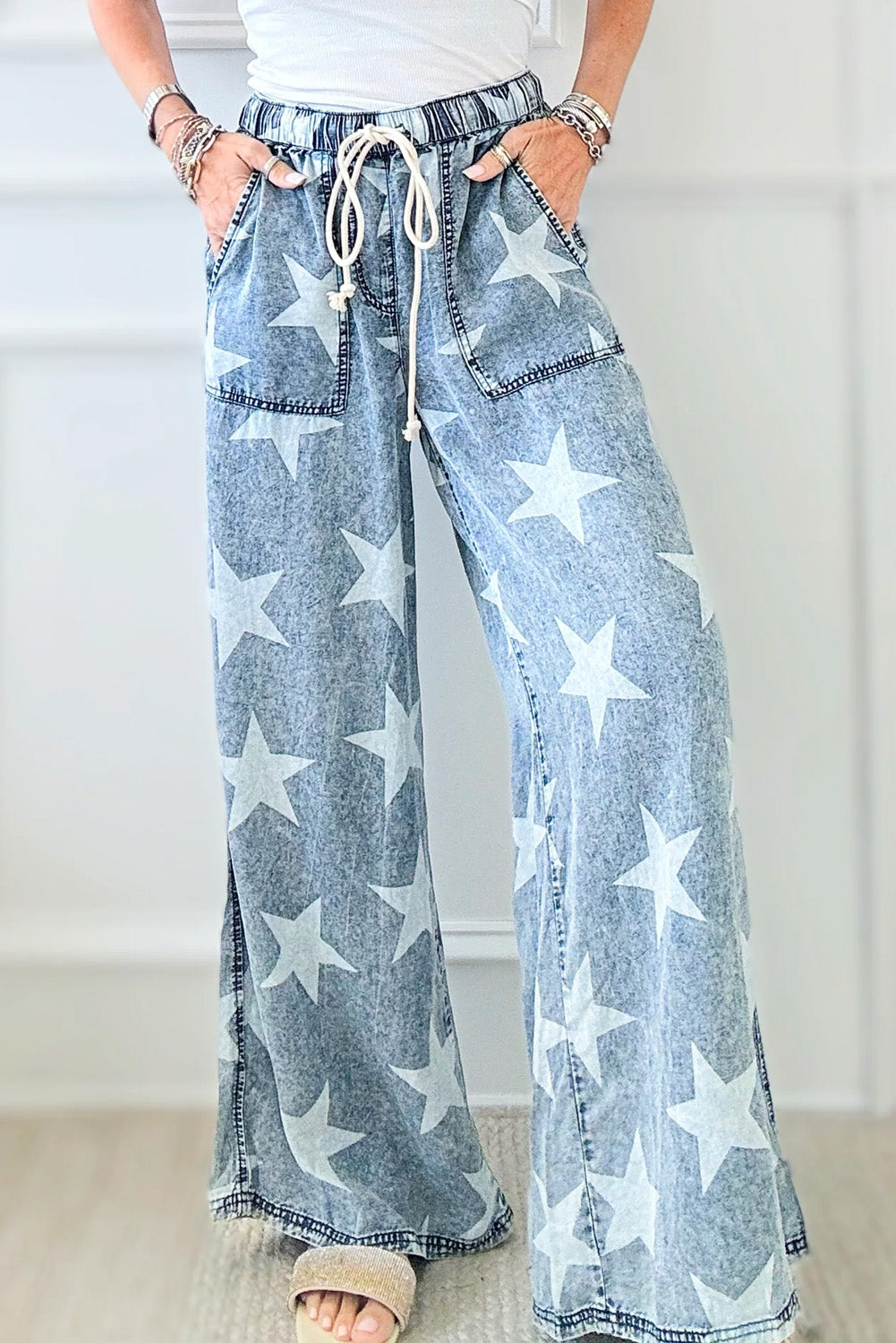 Light Blue Star Print Light Wash Drawstring High Waist Wide Leg JeansMaterial:82%Cotton+10%Polyester+8%Viscose

• Elevate your casual look with these light blue star print high waist jeans, featuring a trendy wide leg design for a ch