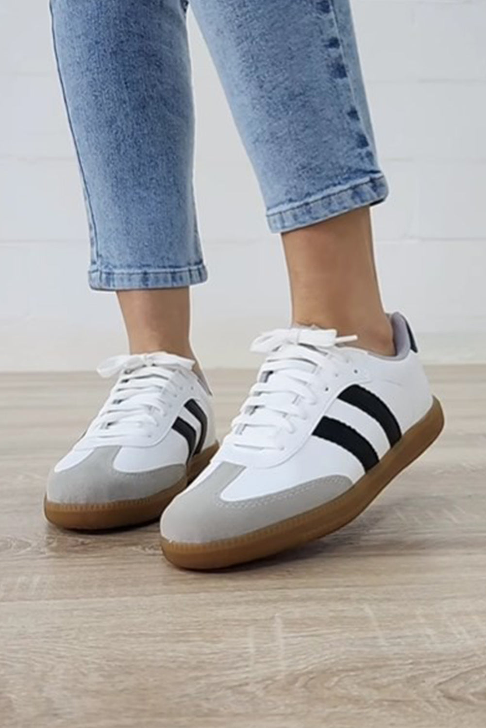 White Striped Lace Up Flat Sneakers• Stylish and versatile, these lace-up sneakers feature a chic white color with subtle stripes.
• Crafted with comfort in mind, the flat sole provides all-day suppo