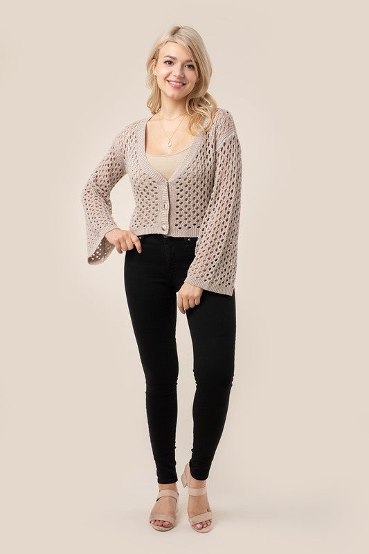 Hole-knit cardigan- Hole-knit cardigan- Pattern type : solid- Neck line : V neck- Sleeve type : bell sleeves- Sleeve length : long sleeves- Stretch : stretch- Sheer : sheer due to loo