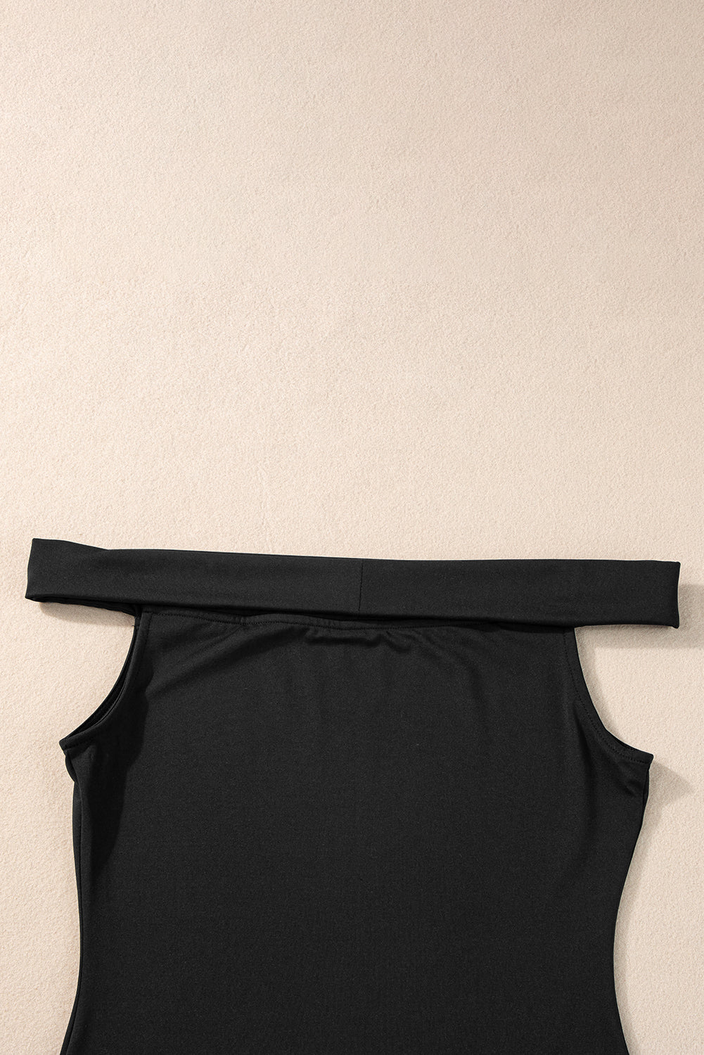 Black Solid Color Folded Off Shoulder Slim BlouseMaterial:92%Polyester+8%Elastane



		This trendy and flattering slim top is crafted to provide a fashionable and modern look, making it a versatile choice for var