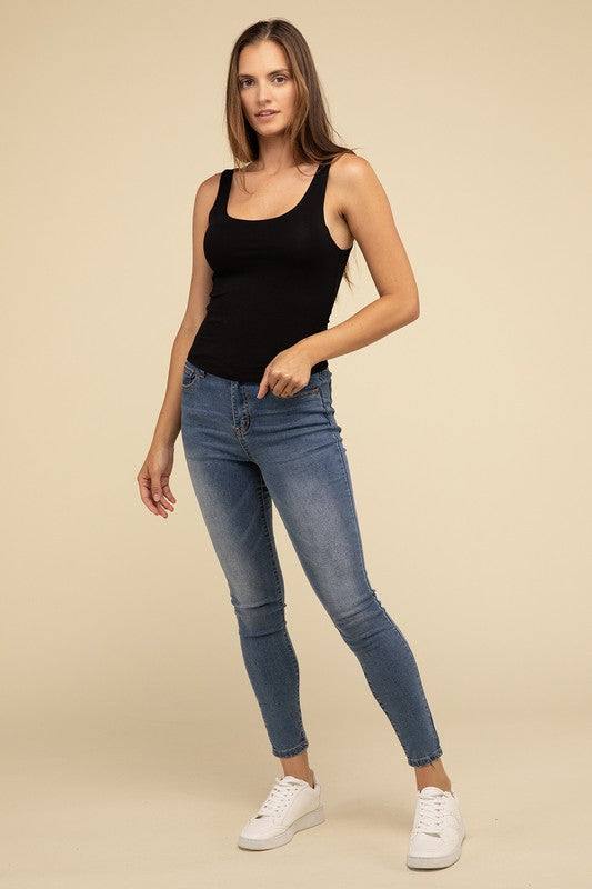 Double Layer Round Neck Tank TopThe Double Layer Round Neck Tank Top offers a stylish and comfortable option for any wardrobe. Featuring a classic round neckline and a unique double-layer design, t