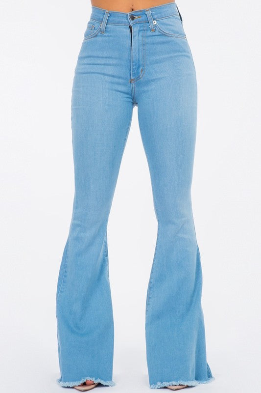 Bell Bottom Jean in Light BlueHigh Rise Bell Bottom Jean features front and back functional pockets, front button and zipper closure, 34" Inseam Length, Frayed Hem, Light Blue Denim, Made in USA
