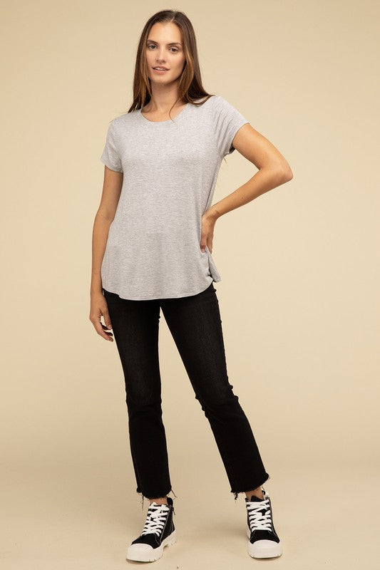 Flowy Round Hem Rayon Short Sleeve TopThe Flowy Round Hem Rayon Short Sleeve Top is the perfect addition to your casual wardrobe. Crafted from soft, lightweight rayon, this top features a relaxed fit and