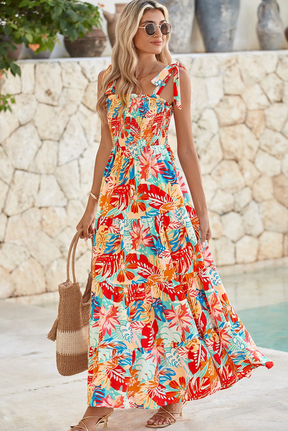 Multicolor Boho Tropical Print Smocked Ruffle Tiered Maxi DressMaterial:100%Polyester



		•The tiered design of the dress adds volume, creating a flowy and feminine look.
	
	
		•Smocked bodice and tie shoulder straps give 