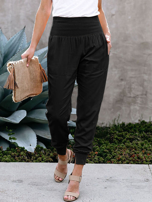 Black Casual Pocketed Tapered Elastic Waist JoggersMaterial:95%Polyester+5%Spandex



		Effortless to dress up or down
	
	
		Stretchy high waistband, side pockets and a billowy harem style silhouette
	
	
		A 