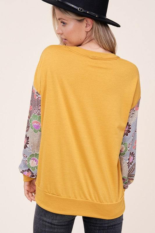 WOVEN FLORAL MIXED TOPFRENCH TERRY SOLID AND WOVEN FLORAL PRINT MIXED LONG SLEEVE SIDE POCKET RAW EDGE DETAIL TOP - MADE IN U.S.A.
Style: Casual
Print / Pattern: SOLID AND WOVEN FLORAL 
F