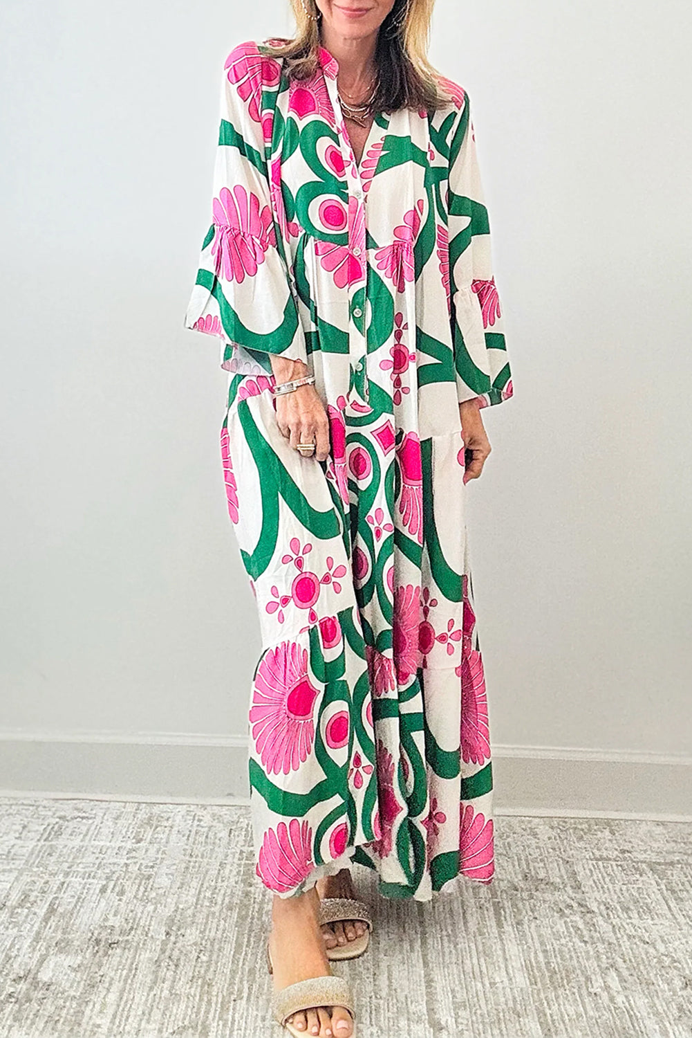 Pink Boho Abstract Button V Neck Oversized Maxi DressMaterial:100%Polyester

• Embrace your inner free spirit with our maxi dress, featuring a stunning abstract pattern and bell sleeves that exude bohemian charm. 
• 